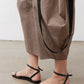 Walnut brown wide-leg capri pants with black cord ties and ankle-length drape