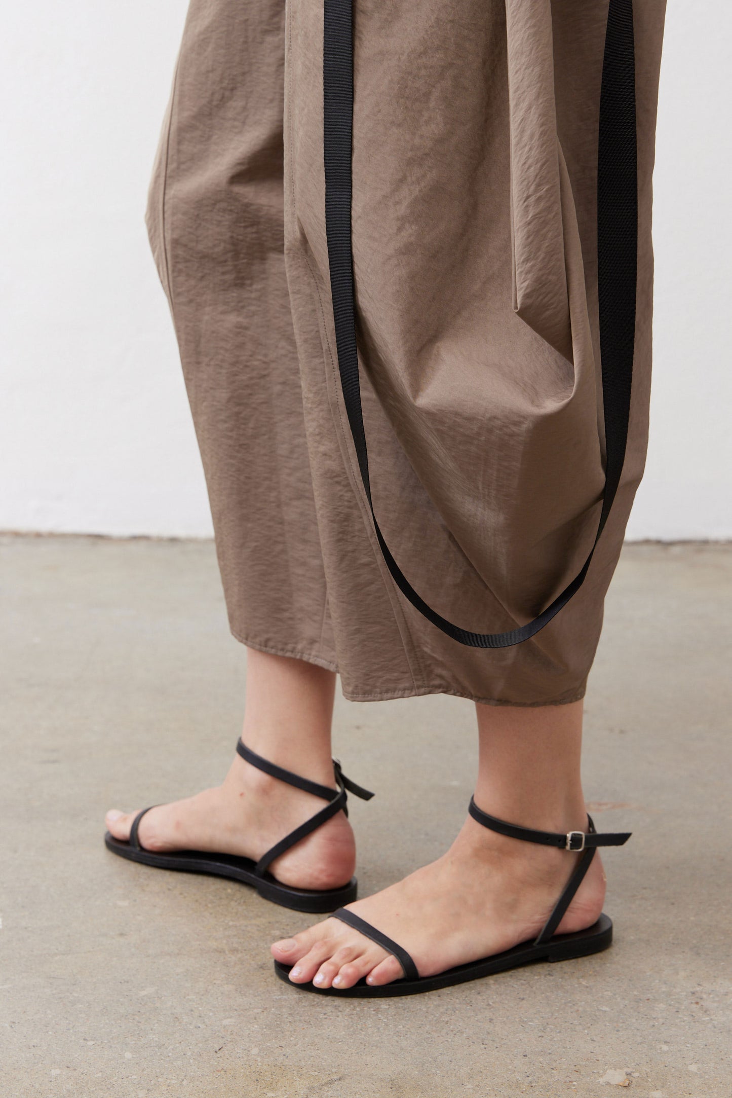 Walnut brown wide-leg capri pants with black cord ties and ankle-length drape