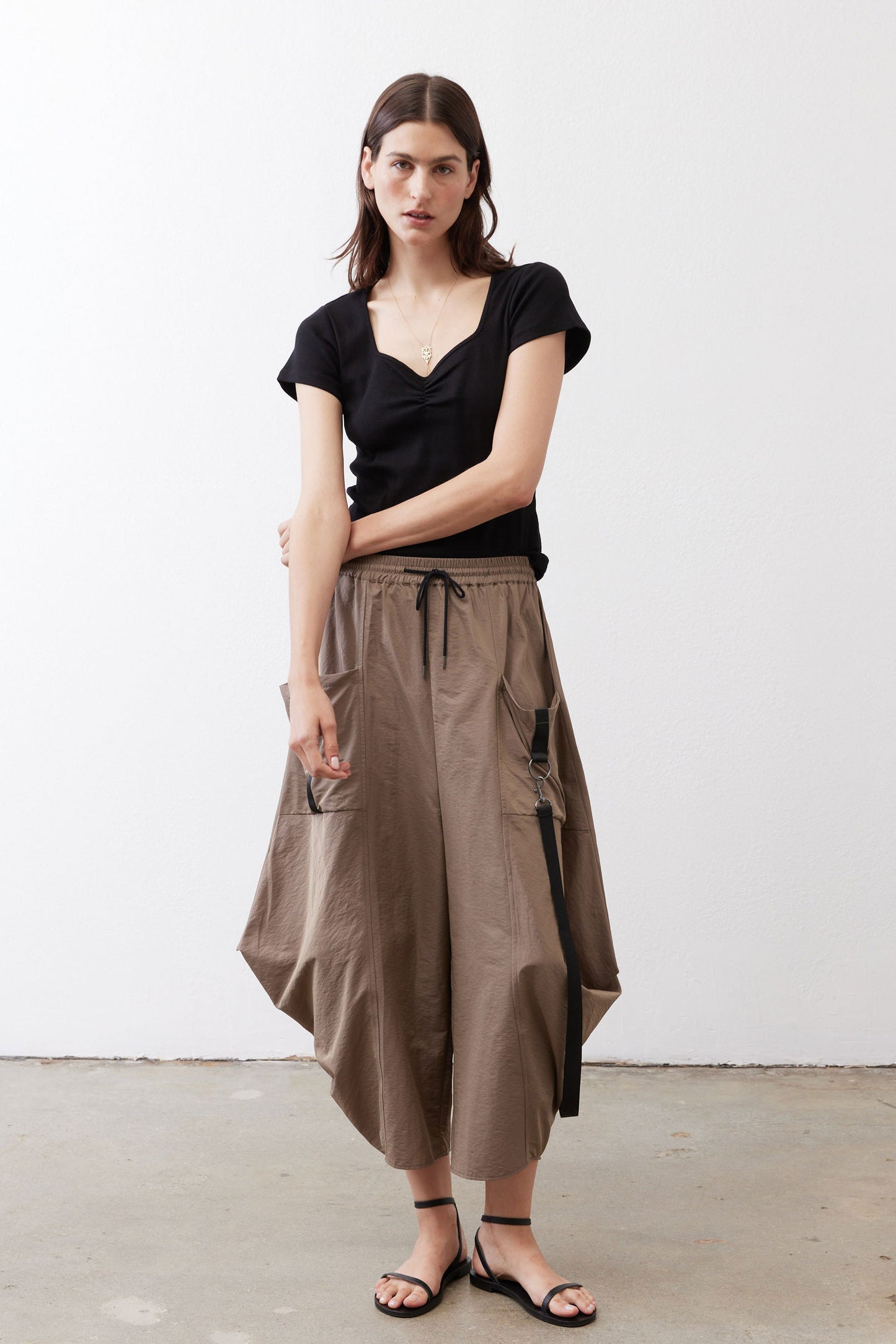 Walnut brown wide-leg pants with elastic waistband, drawstring, and hanging side pocket