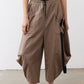 Walnut brown wide-leg pants with elastic waistband and black drawstring, cropped
