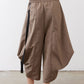 Walnut brown wide-leg capri pants with elastic waist and black-edged pocket panels