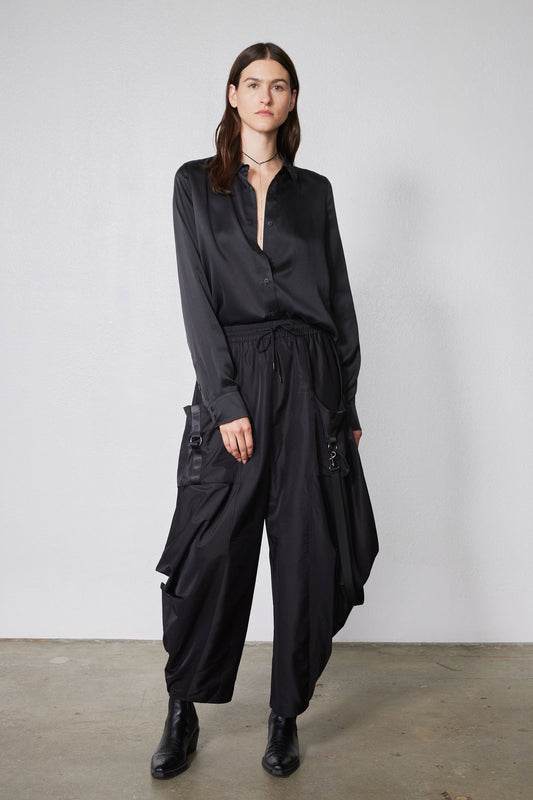 Black wide-leg parachute pants with drawstring waist and cargo pockets