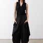 Black wide-leg parachute pants with drawstring waist and relaxed cropped fit
