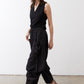 Black wide-leg parachute pants with drawstring waist and relaxed, billowy legs.