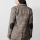 Brown plaid blazer with black elbow patches, back view