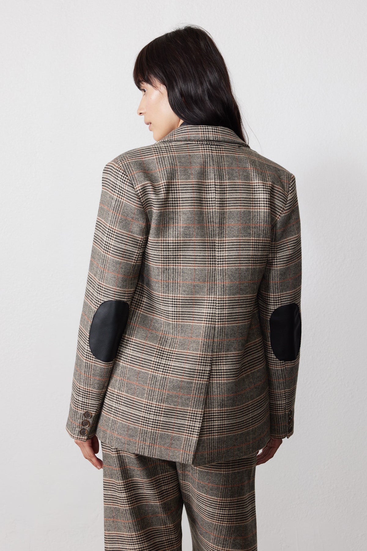 Brown plaid blazer with black elbow patches, back view
