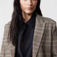 Brown plaid blazer with black elbow patches and chest pocket detail