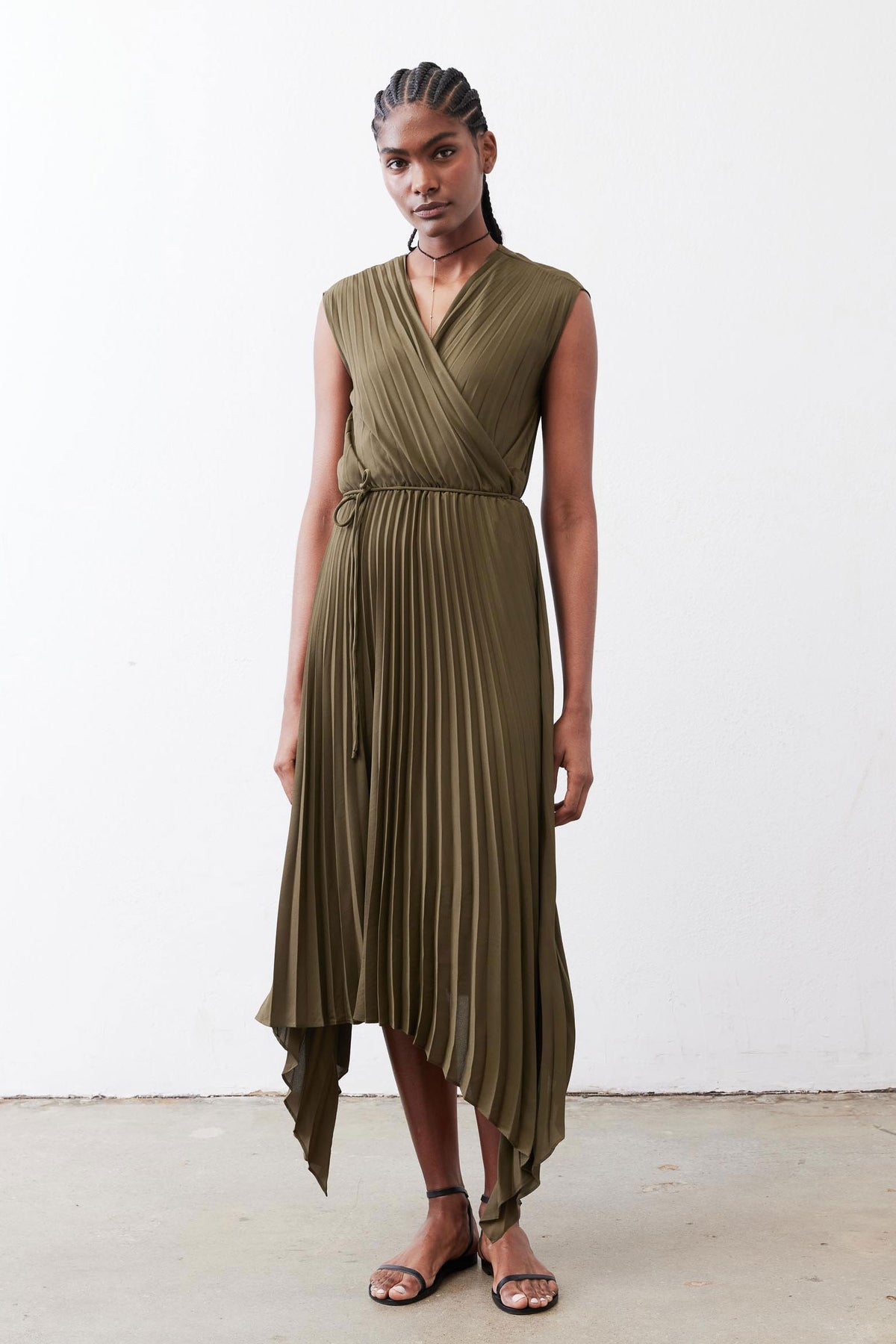 Olive pleated wrap dress, sleeveless V-neck with draped asymmetrical hem.