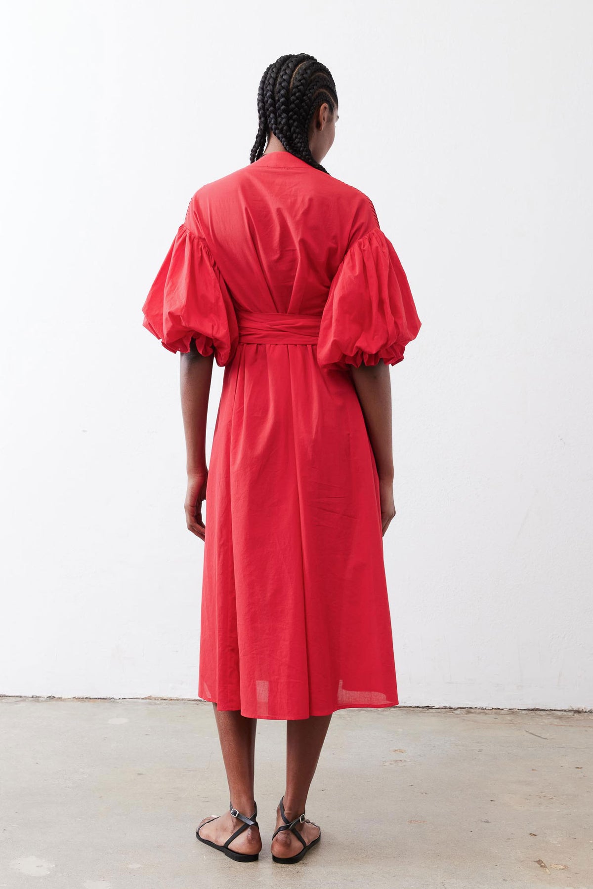 Crimson pintuck midi dress with puff sleeves and tied waist, back view