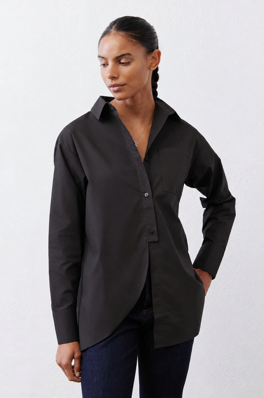 Black asymmetric button-down shirt with pointed collar and button placket, long sleeves.