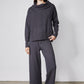 Charcoal sweater lounge set with draped cowl hoodie and wide-leg drawstring pants