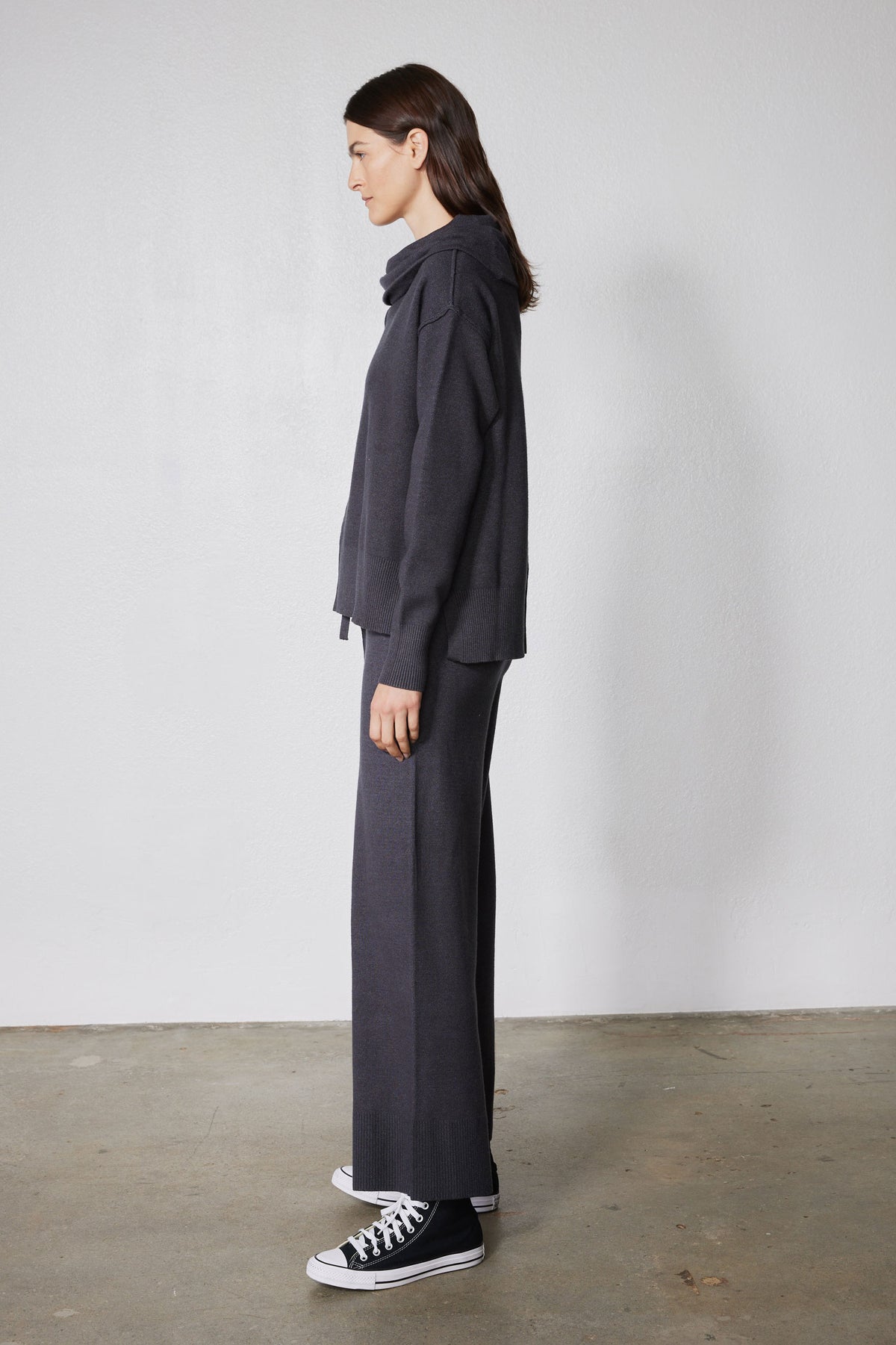 Charcoal lounge set with cowl hoodie and wide-leg pants, side view