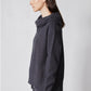 Charcoal oversized cowl hoodie top over wide-leg lounge pants, side view