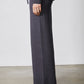 Charcoal wide-leg lounge pants with drawstring and low-top sneakers