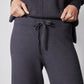 Charcoal lounge pants with tied drawstring at waist, paired with cowl hoodie