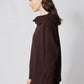 Chocolate plum cowl-neck sweater with long sleeves, draped hood detail, side view
