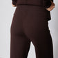 Chocolate plum wide-leg lounge pants with smooth fabric and side seam, close-up