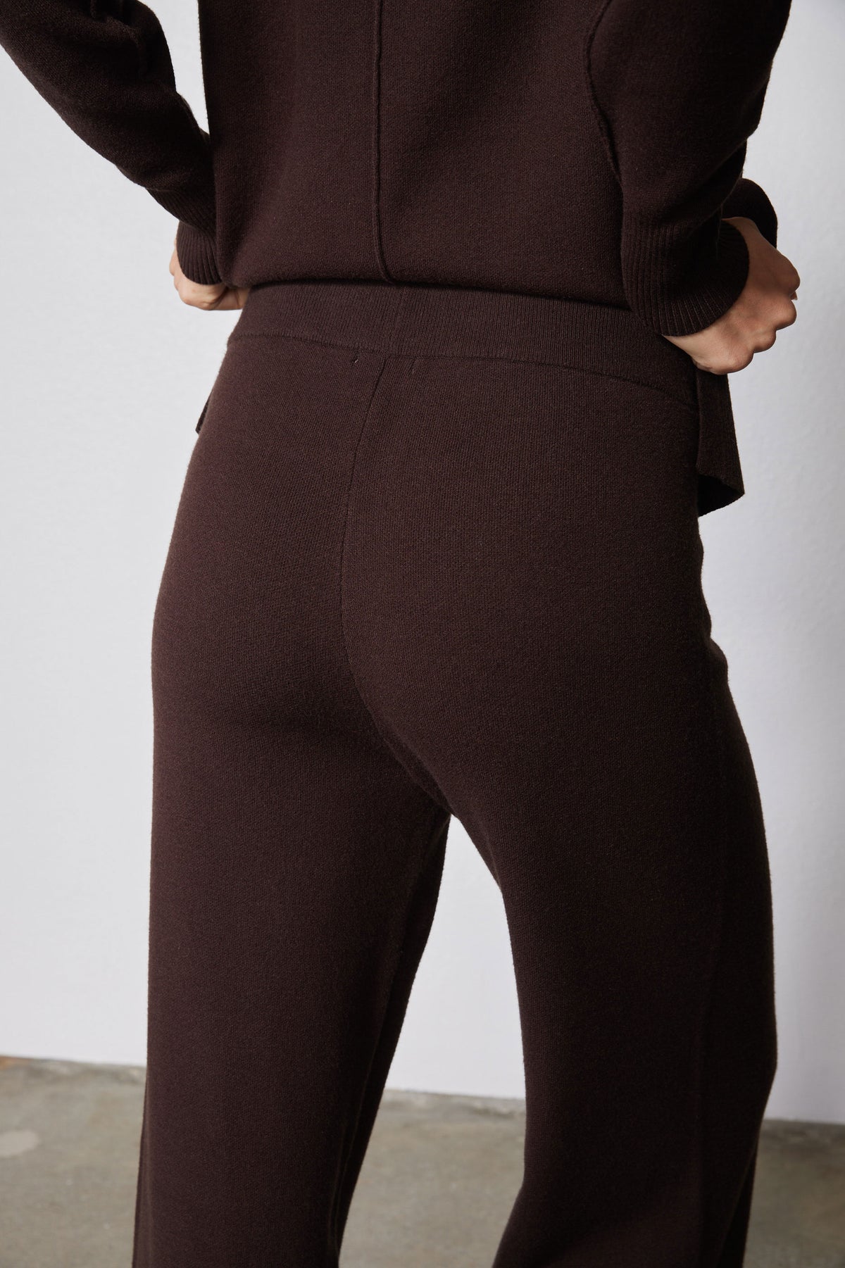 Chocolate plum wide-leg lounge pants with smooth fabric and side seam, close-up