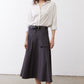 White oversized tunic with black dot print, button-front and slightly puffed sleeves