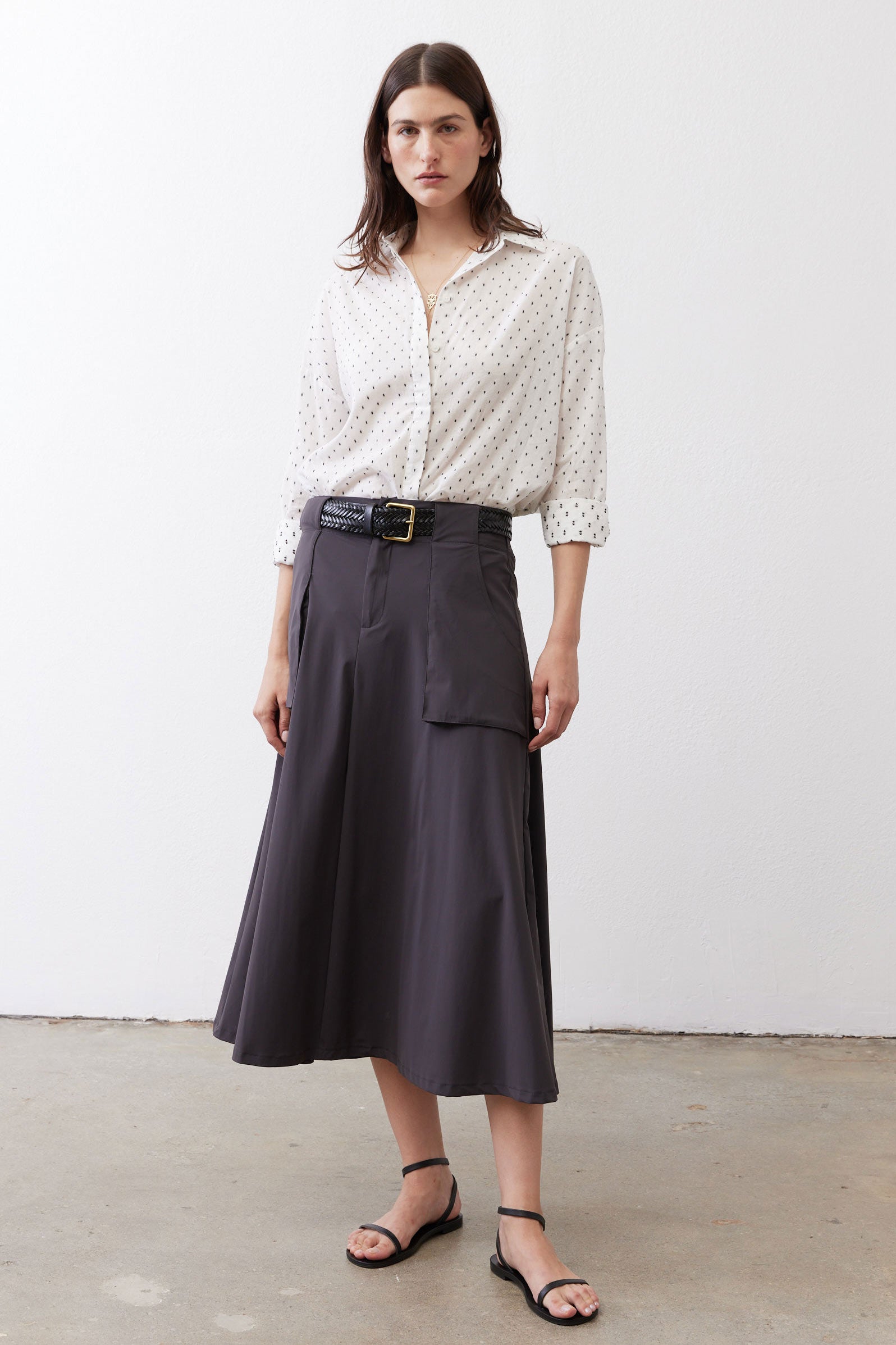 White oversized tunic with black dot print, button-front and slightly puffed sleeves