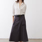 White oversized tunic with black dot pattern, button-front and rollable three-quarter sleeves