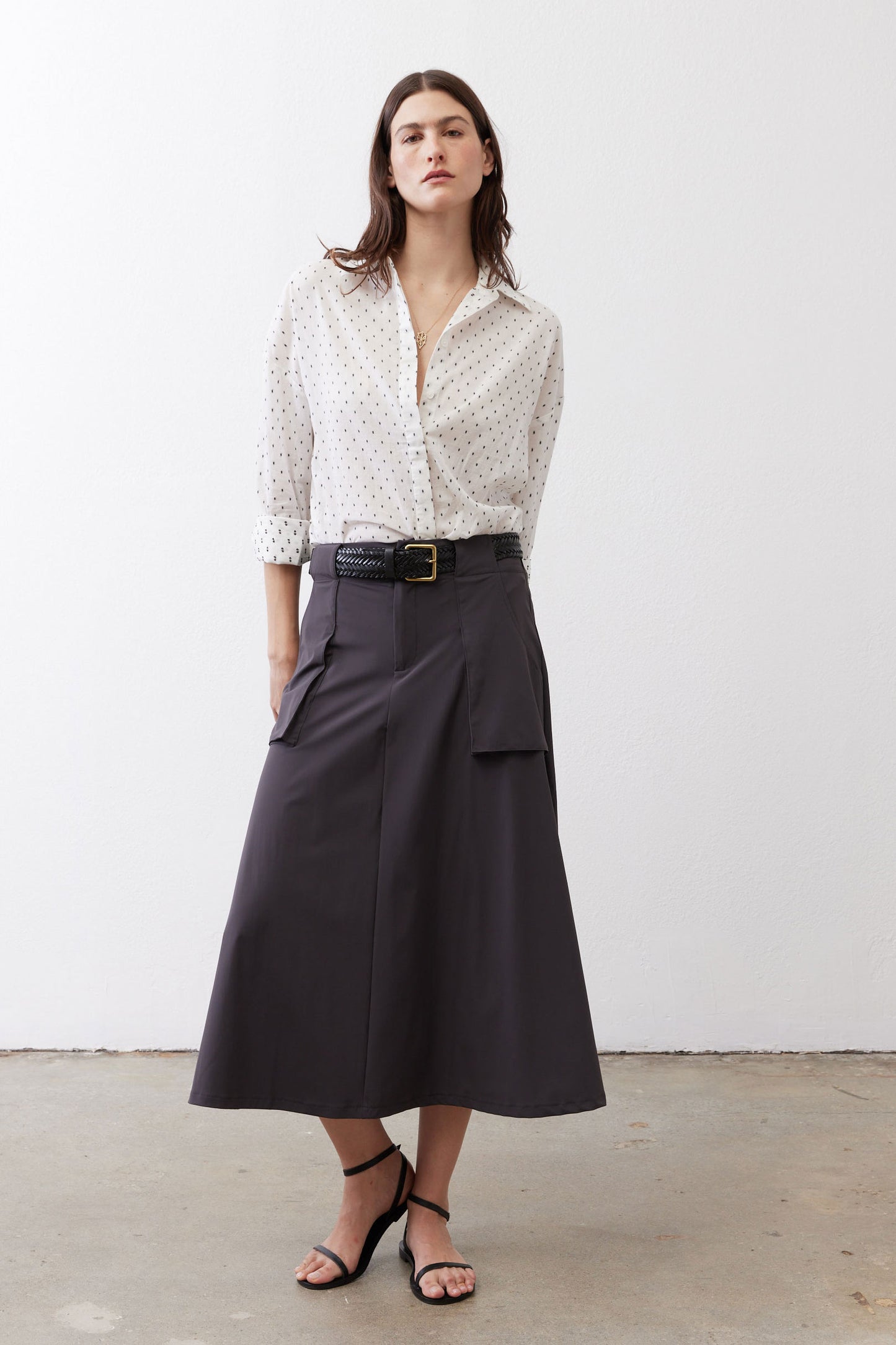 White oversized tunic with black dot pattern, button-front and rollable three-quarter sleeves