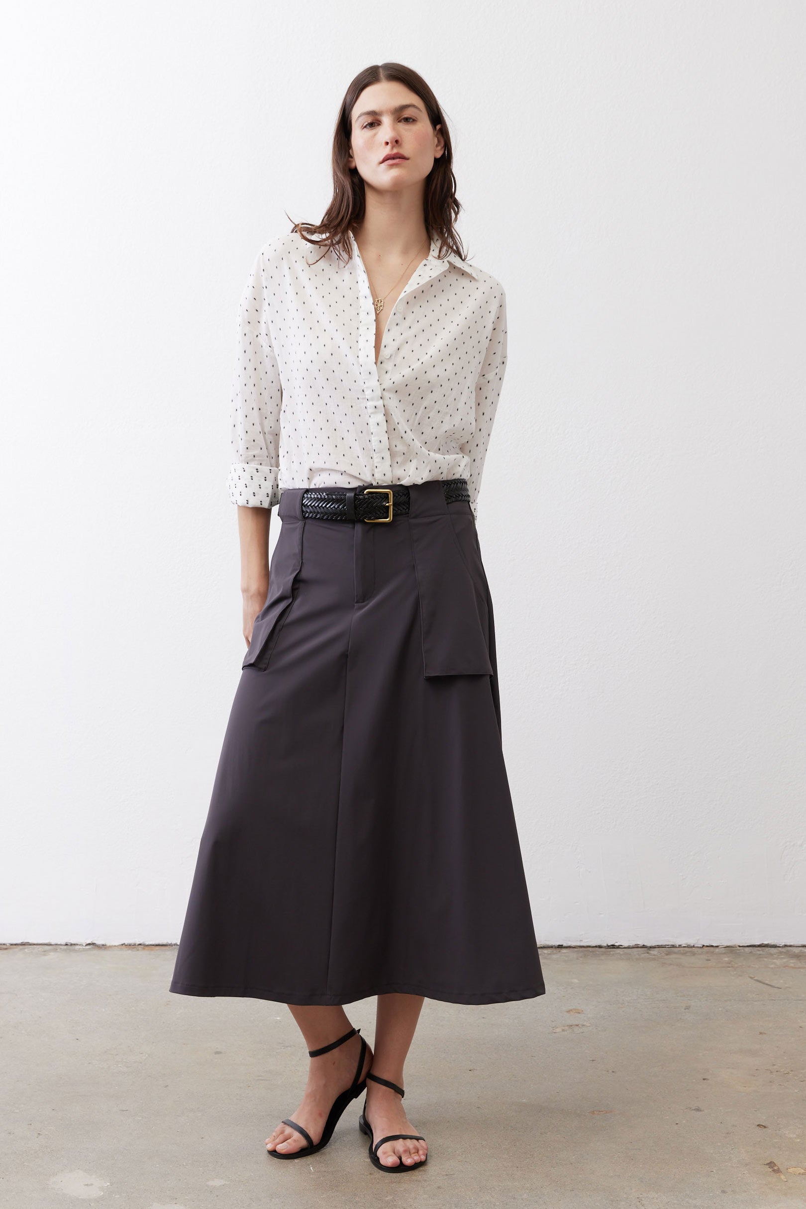 White oversized tunic with black dot pattern, button-front and rollable three-quarter sleeves