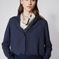 Navy long-sleeve blouse with high collar, zippered front, cuffed sleeves