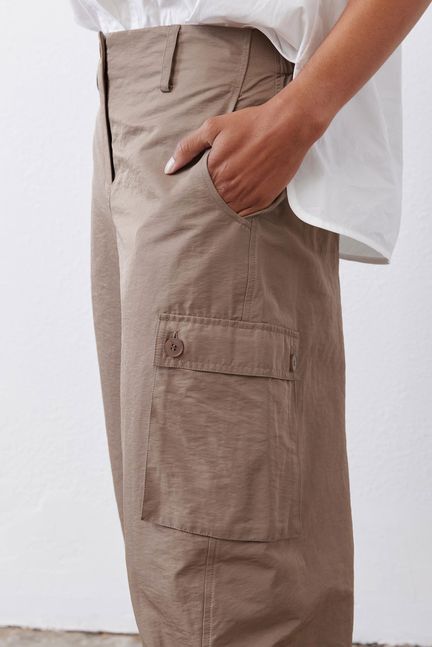 Walnut-brown cargo barrel pants with flap pocket and button closure