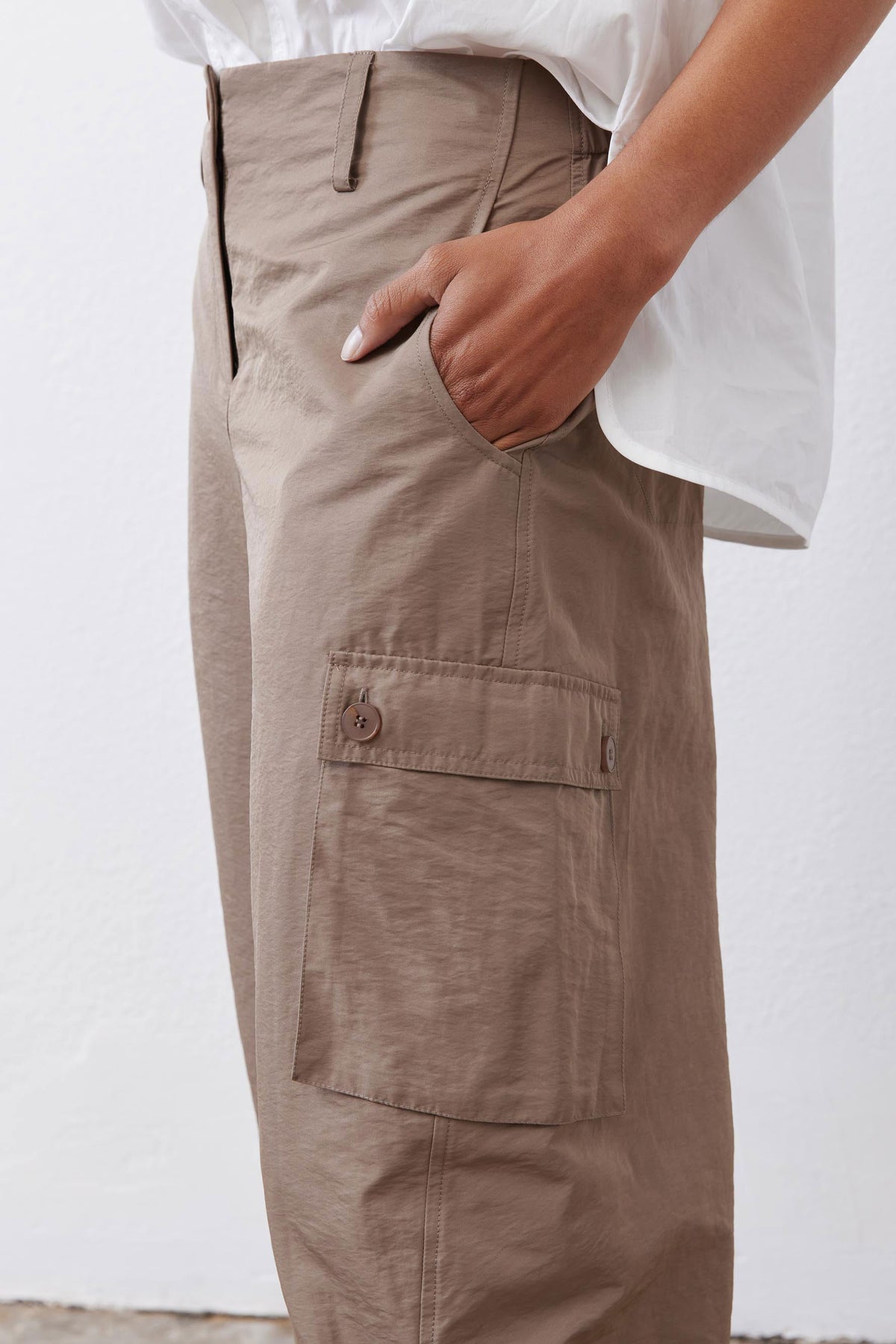 Walnut-brown cargo barrel pants with flap pocket and button closure
