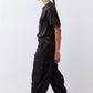 Black cargo barrel pants with side cargo pockets and relaxed straight legs