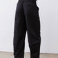 Black cargo barrel pants with elastic waist and relaxed barrel-leg shape