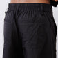 Black cargo barrel pants with elastic waistband and relaxed drape