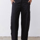 Black cargo barrel pants with cargo pocket panels and ankle-length relaxed fit
