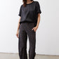 Black relaxed silk top, crew neck, short sleeves, draped fit
