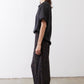 Black relaxed silk top, short sleeves, crew neck, side profile
