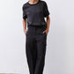 Black relaxed silk top with crew neck and short sleeves, straight hem