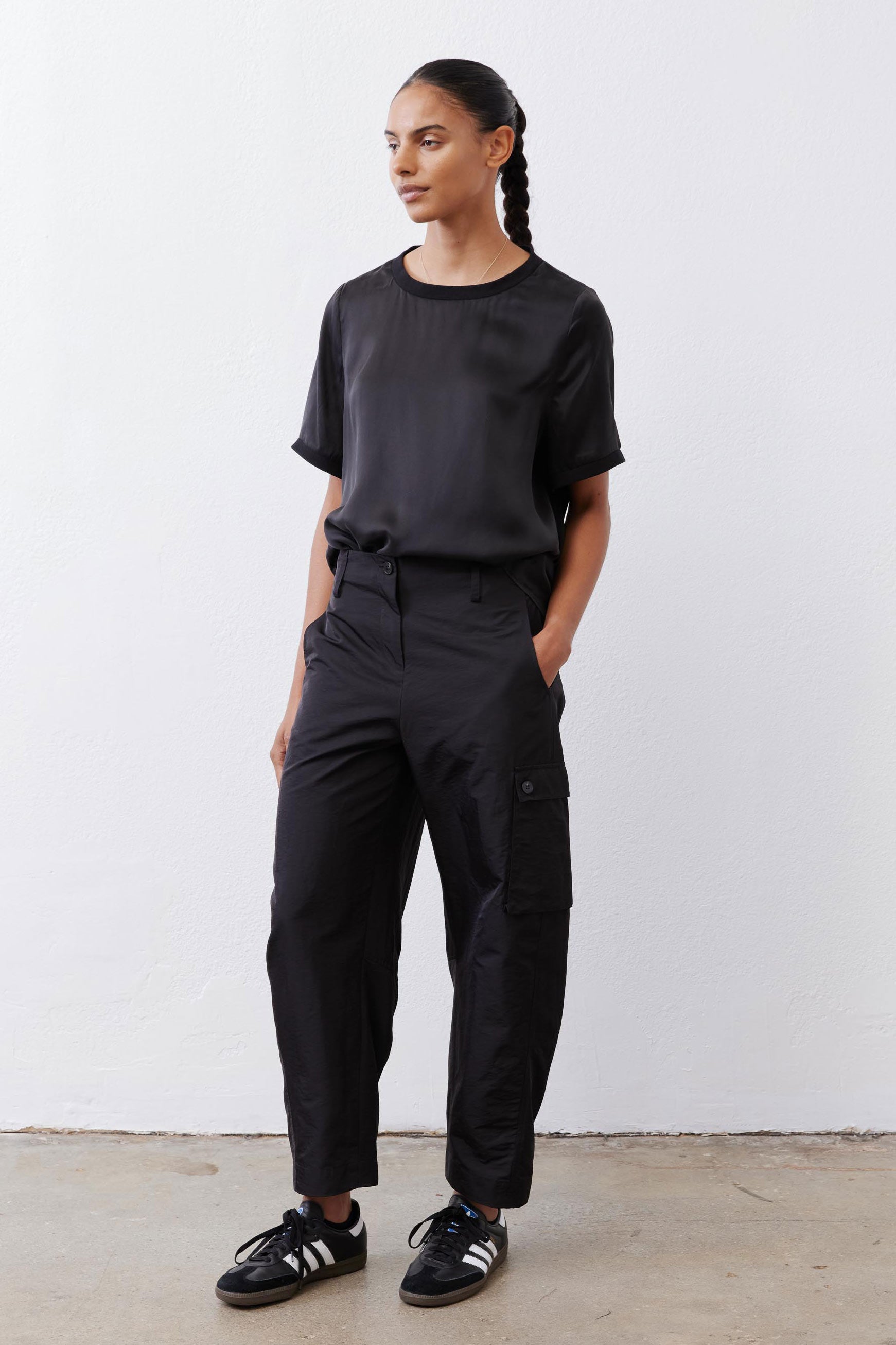 Black relaxed silk top with crew neck, short sleeves, relaxed drape