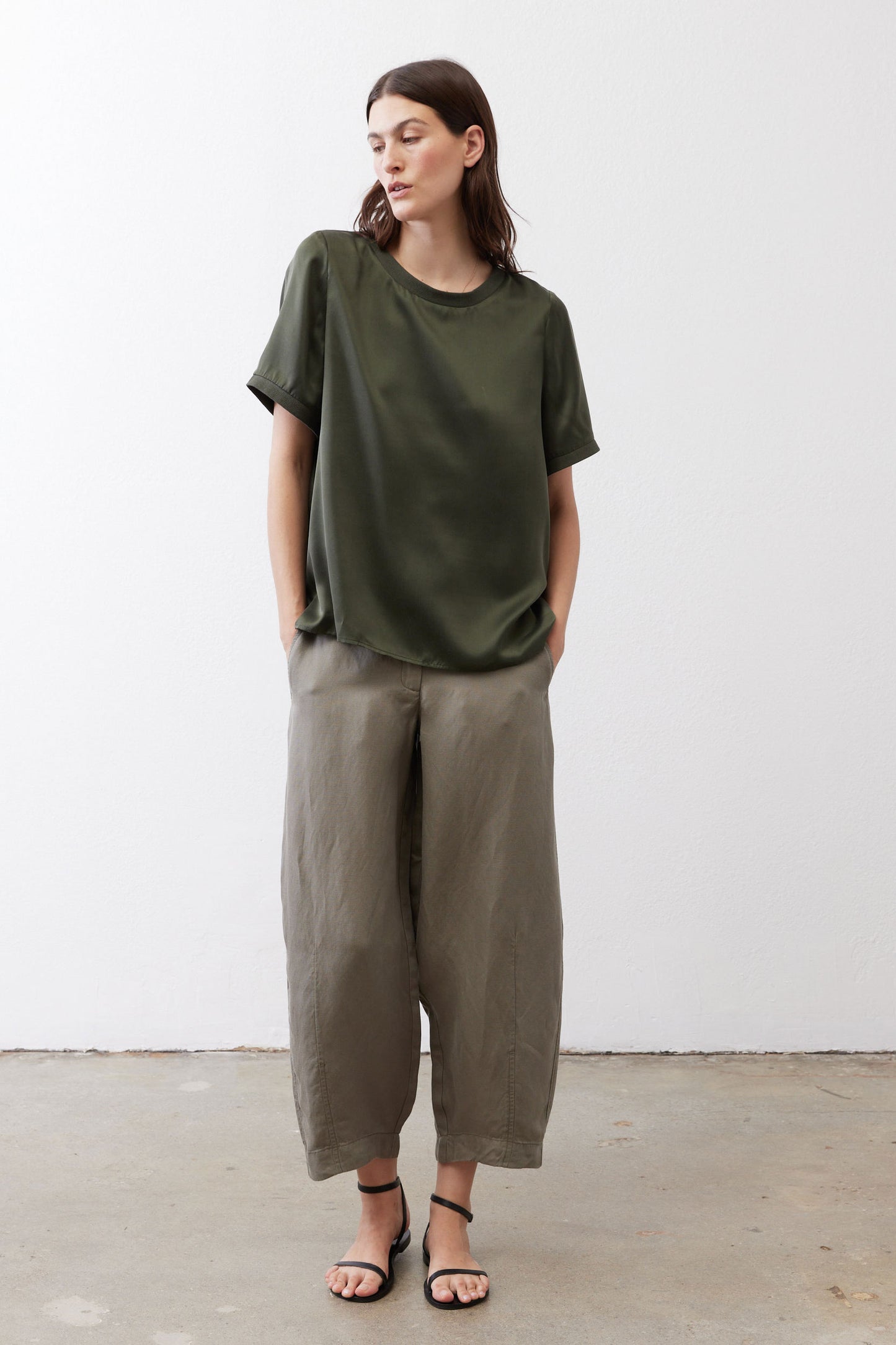 Relaxed forest green silk top, crew neck, short sleeves, straight hem