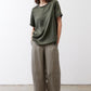 Relaxed forest green silk crew-neck top with short sleeves, draped fit