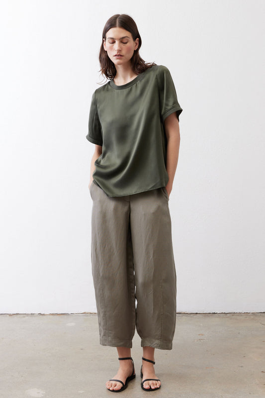Relaxed forest green silk crew-neck top with short sleeves, draped fit