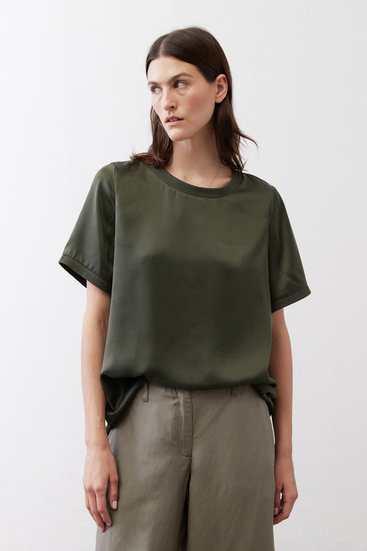 Relaxed forest green silk crew-neck top with short sleeves, front view