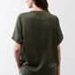 Relaxed forest green silk top, back view, short sleeves and crew neck