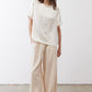 Ivory relaxed silk top with short sleeves and crew neck, loose drape