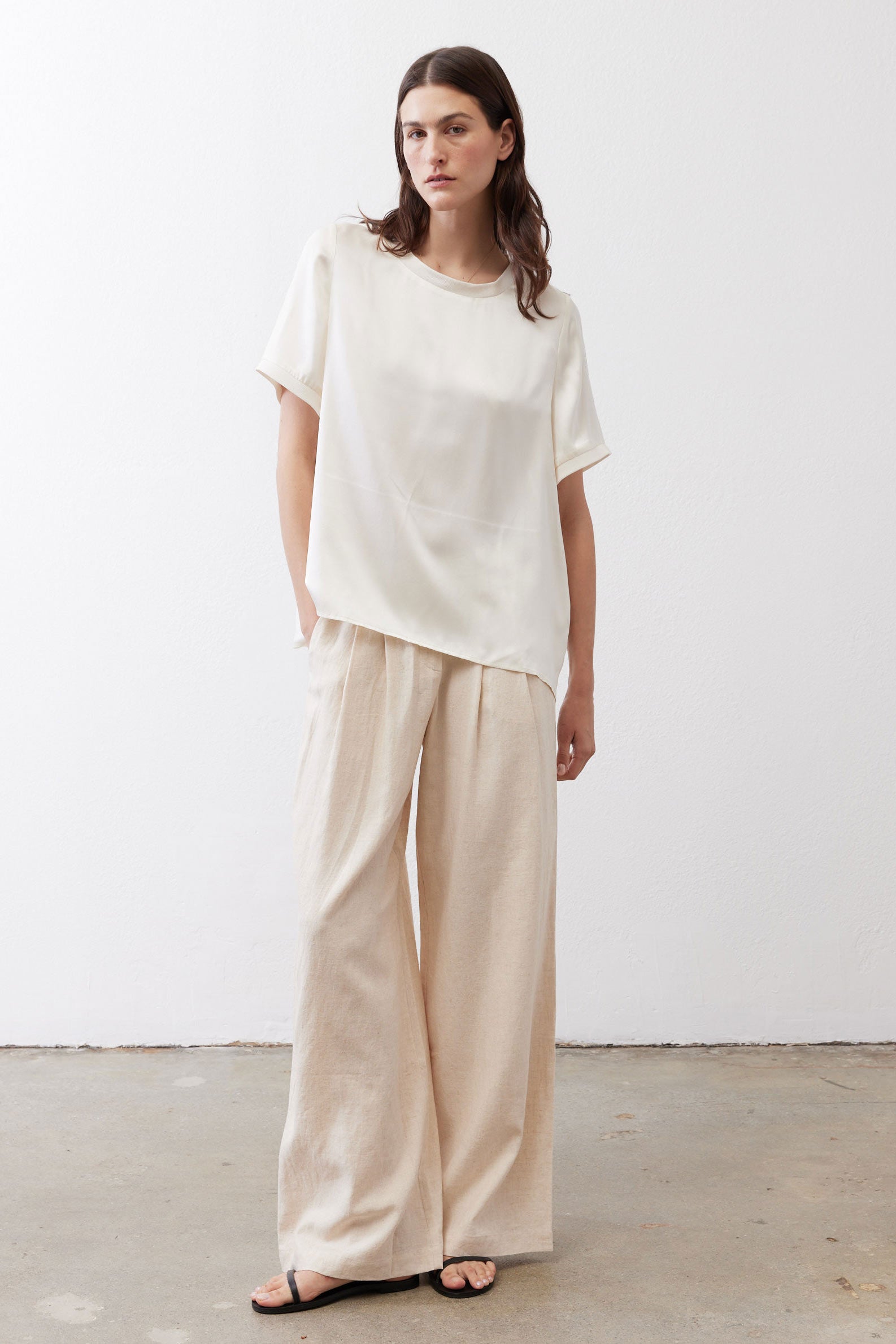 Ivory relaxed silk top with short sleeves and crew neck, loose drape