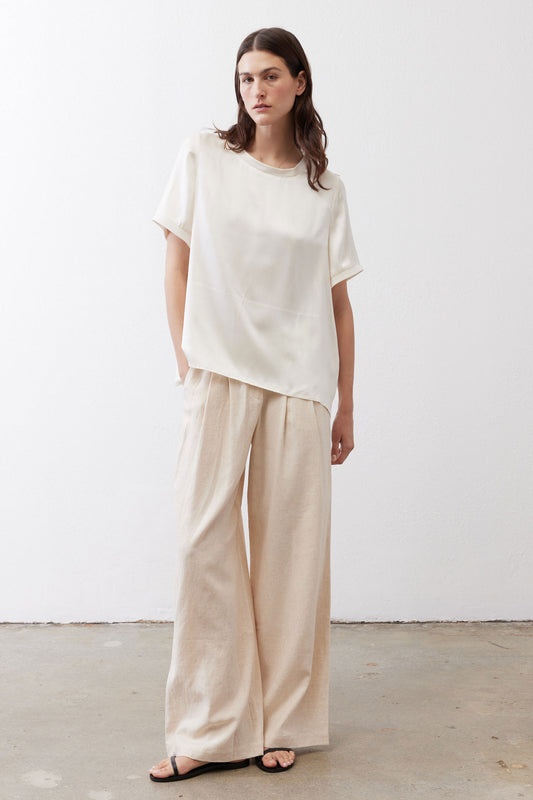 Ivory relaxed silk top with short sleeves and crew neck, loose drape