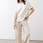 Ivory relaxed silk top with short sleeves and slightly longer hem, loose fit