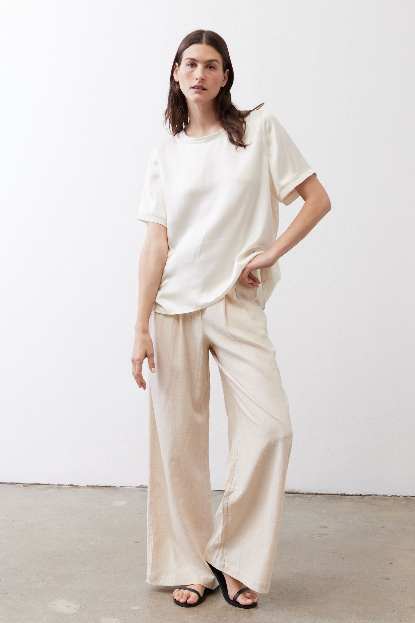 Ivory relaxed silk top with short sleeves and slightly longer hem, loose fit