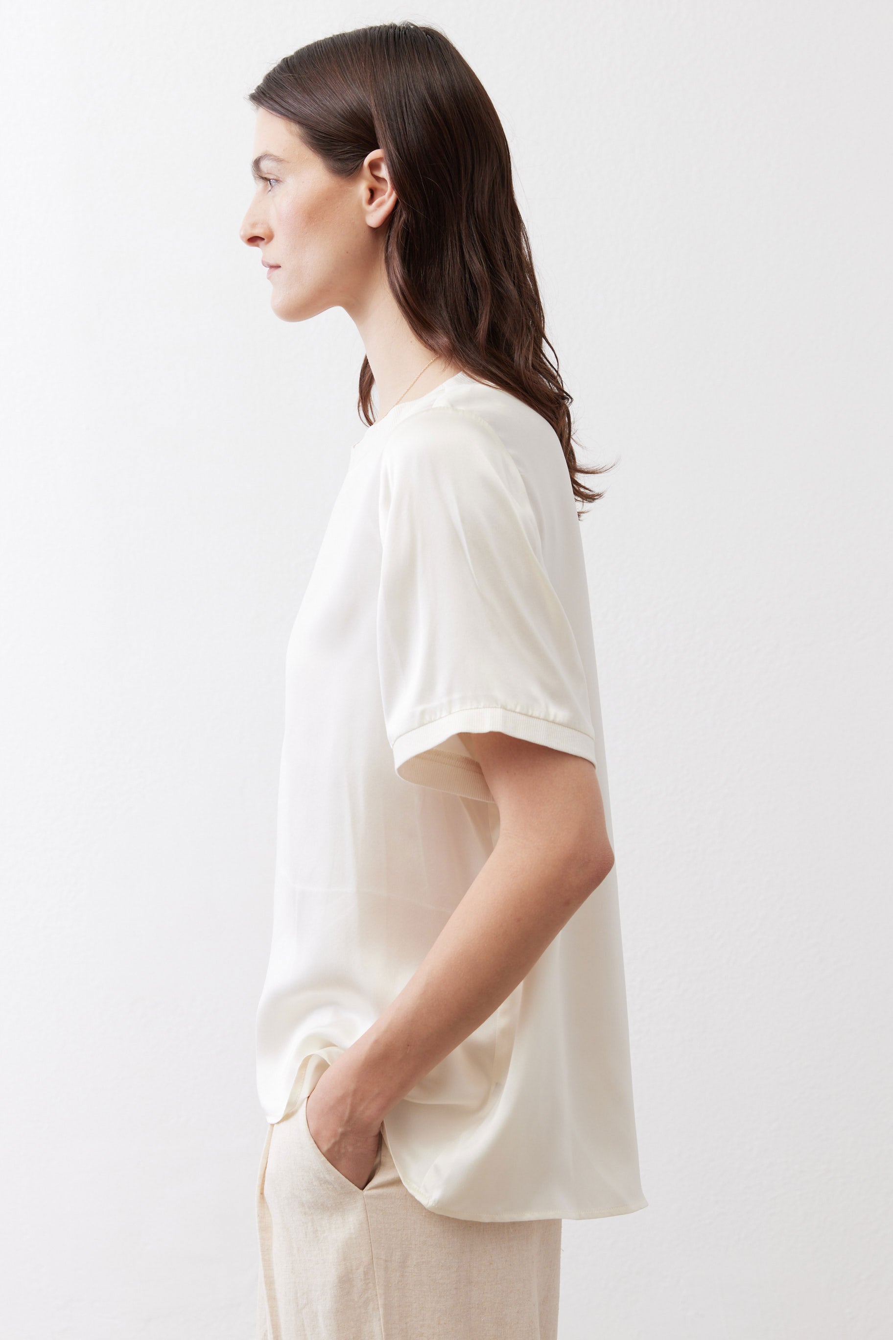 Ivory silk top with crew neck and short sleeves, side view