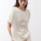 Ivory relaxed silk top with crew neck and short sleeves, front detail